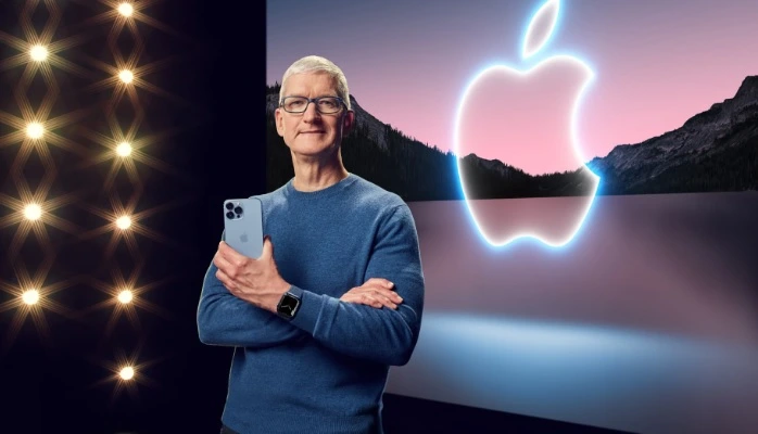 Steve Jobs Holding I Phone with apple logo in back